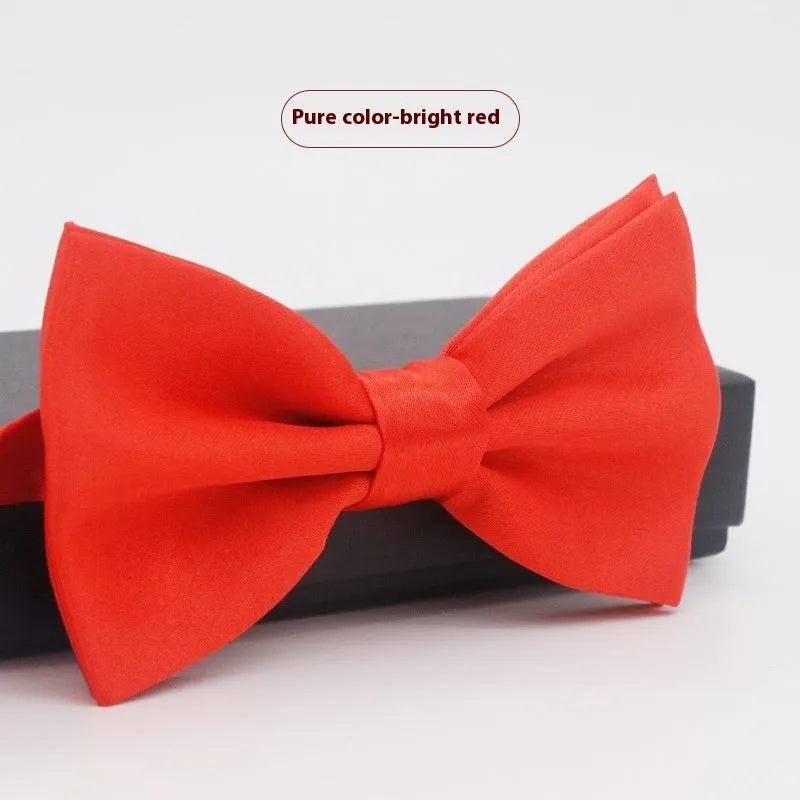 Solid colour flat head bow tie for formal wear in multiple colours including black, red, and blue.
