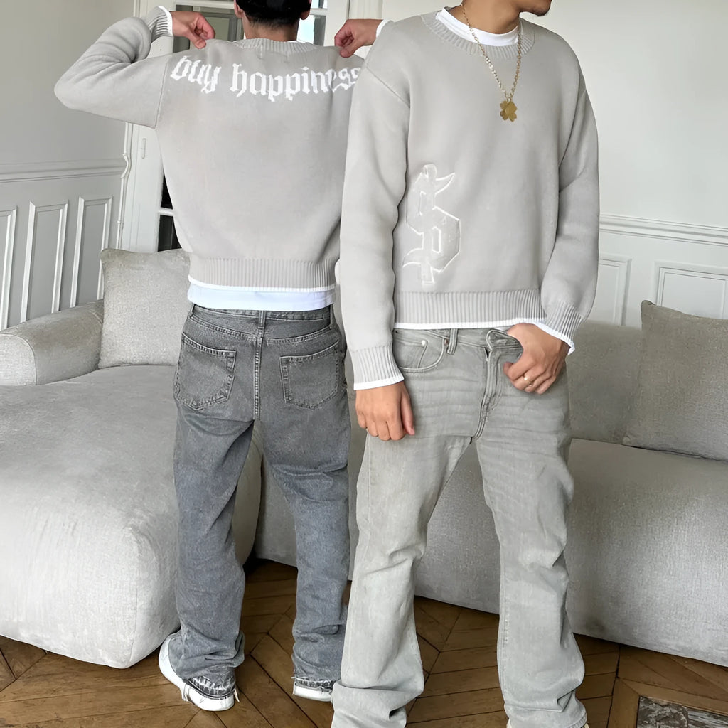 Grey loose-fitting jacquard knitwear coat with long sleeves on hanger
