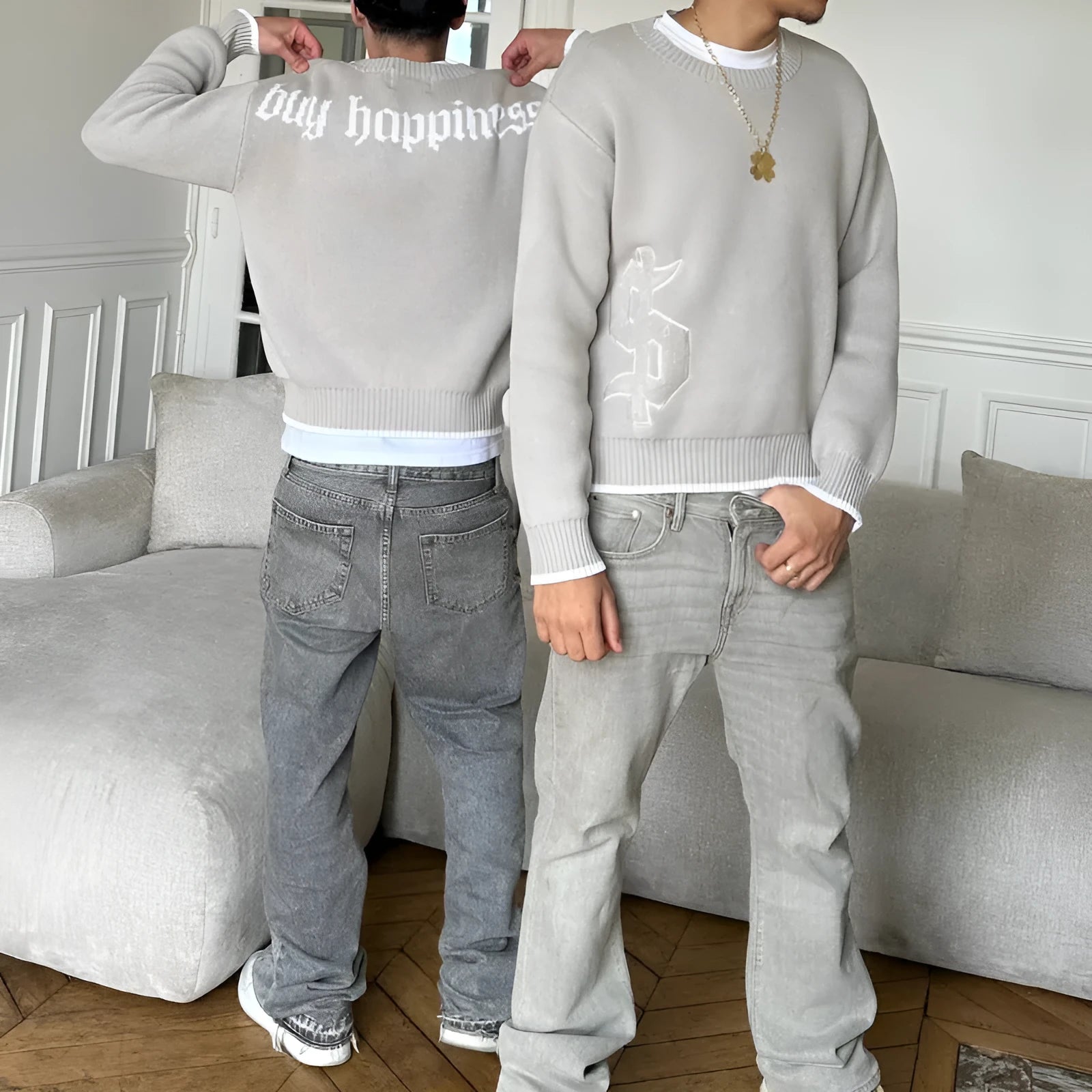 Grey loose-fitting jacquard knitwear coat with long sleeves on hanger