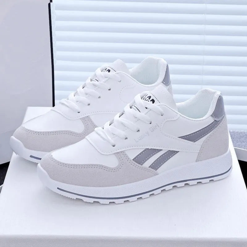 Women's lightweight running sports shoes in white and gray with lace-up front and PU outsole