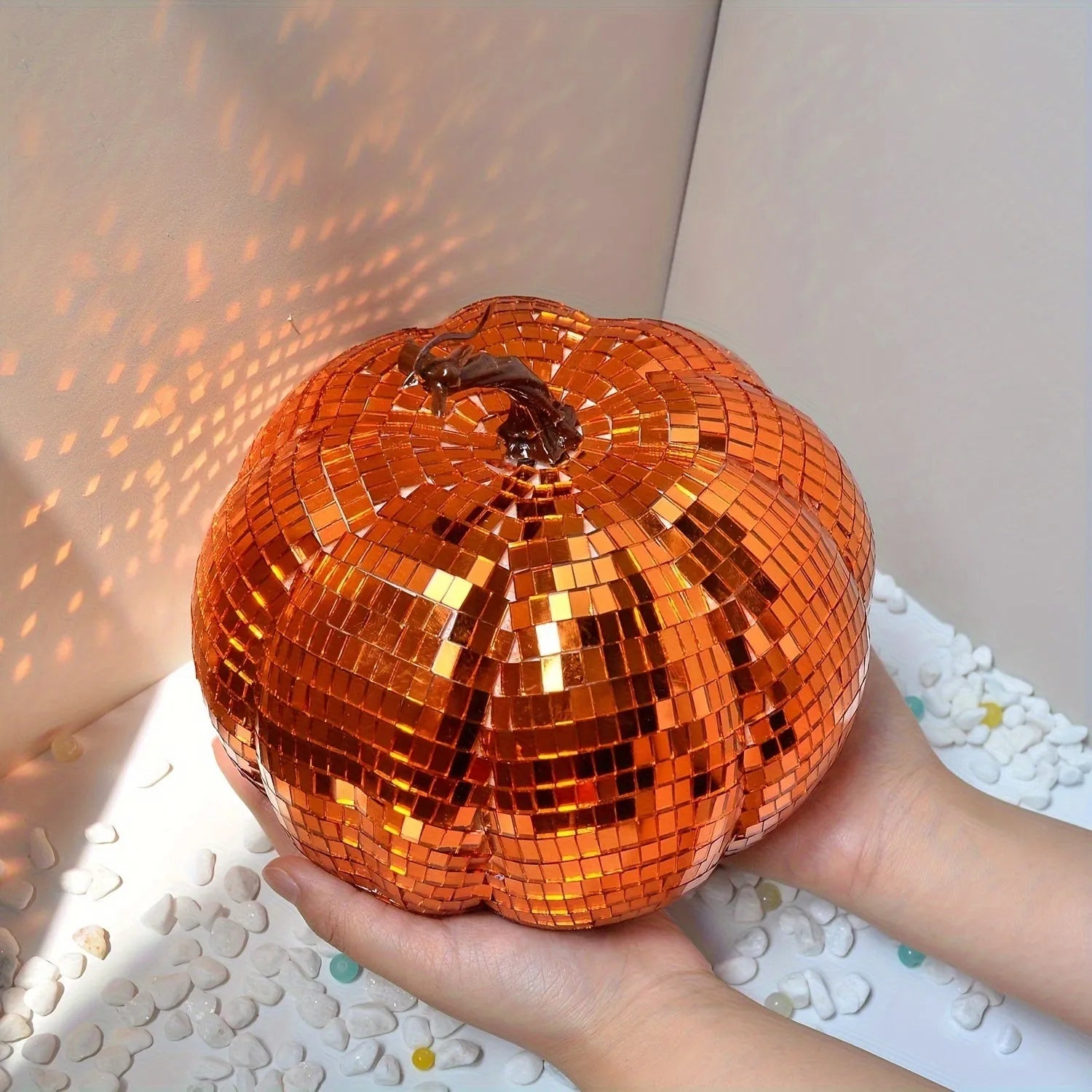 A Chinese-style glass pumpkin ornament with a mirror finish, shown in one of five available sizes.