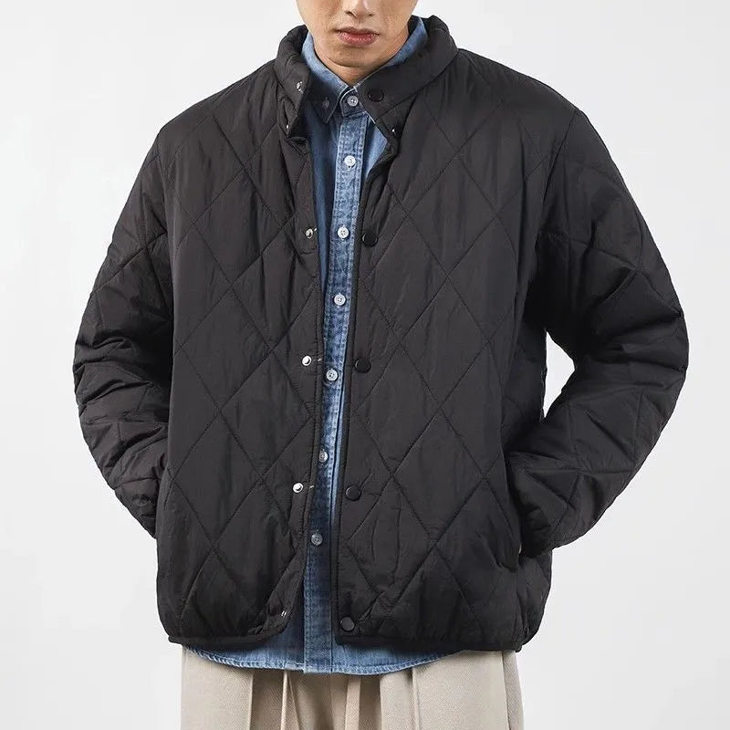 Men's black diamond lattice patterned winter jacket showing lengthened design and medium thickness padding