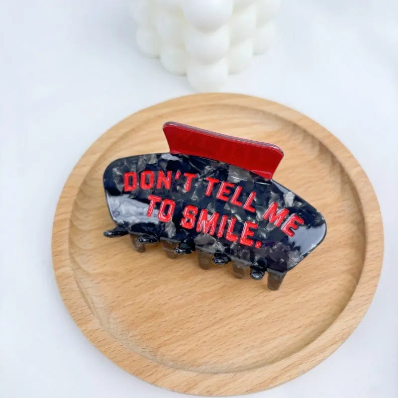 Halloween hair clip with detailed acetic acid shark and bat design in one of four colour variations.