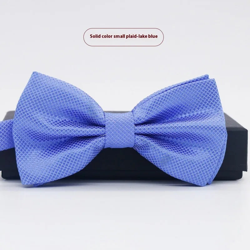 Solid colour flat head bow tie for formal wear in multiple colours including black, red, and blue.