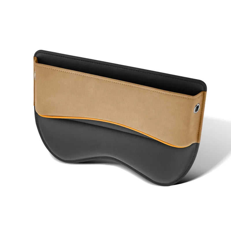 Leather car seat storage box in beige colour on a car passenger seat.