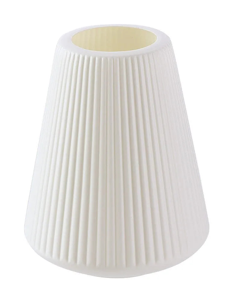 White melamine plastic decorative flower vase measuring 16cm by 20cm on a desktop