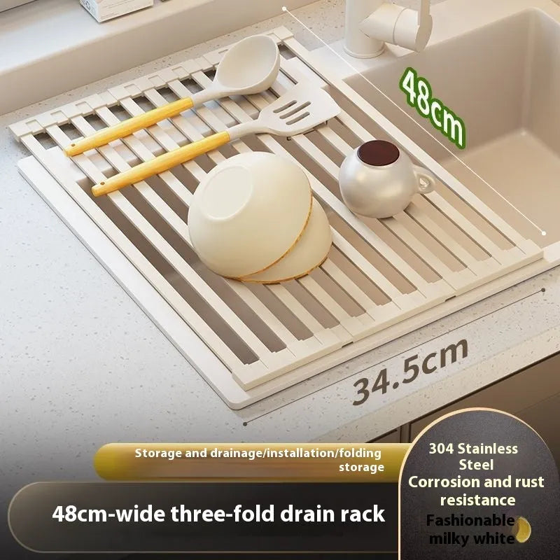 Milky white foldable stainless steel kitchen draining rack shown in a sink.