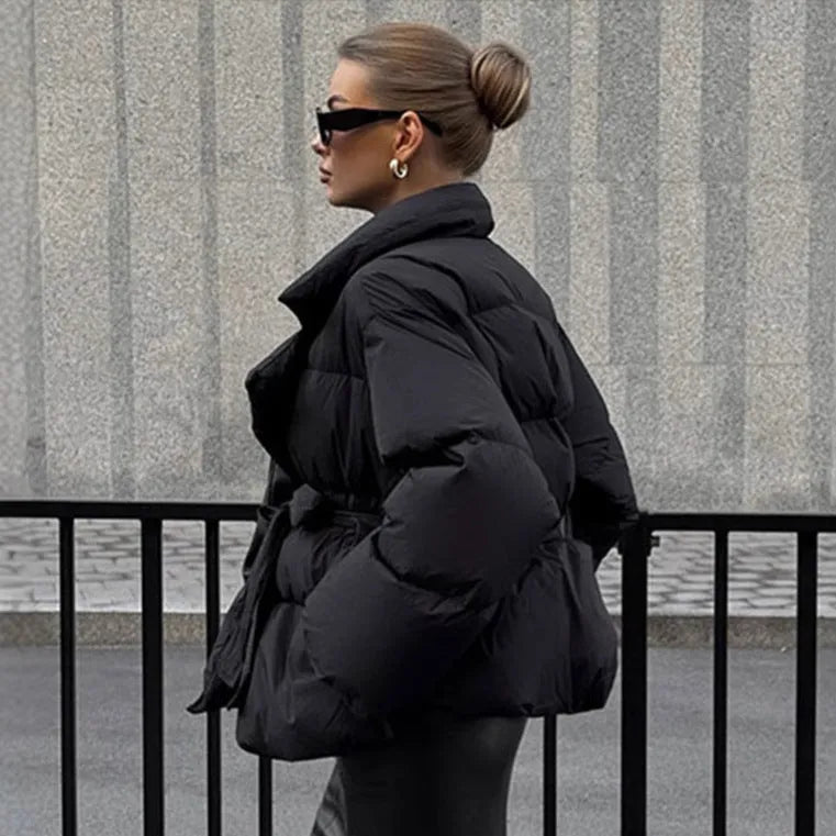 Waist-controlled lace-up lapel long sleeve polyester jacket in black with drawstring waist, front view.