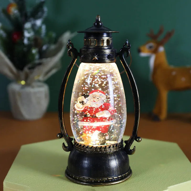 Plastic Christmas oil lamp decoration with LED light showing snowman figurine inside crystal ball dome.