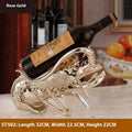 Lobster-shaped decorative wine bottle holder ornament in rose gold or silver resin.