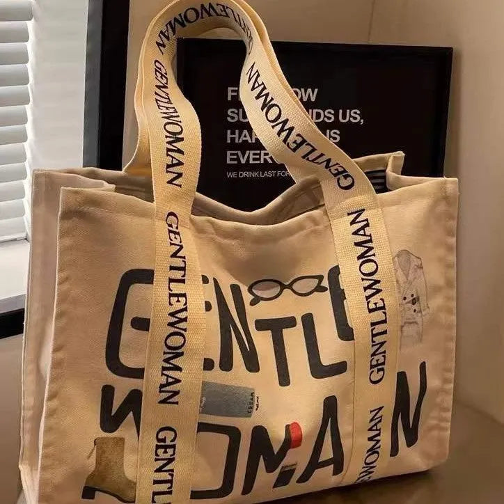 Large capacity cotton canvas tote bag with printed design options including black letter, coloured letter and pattern styles