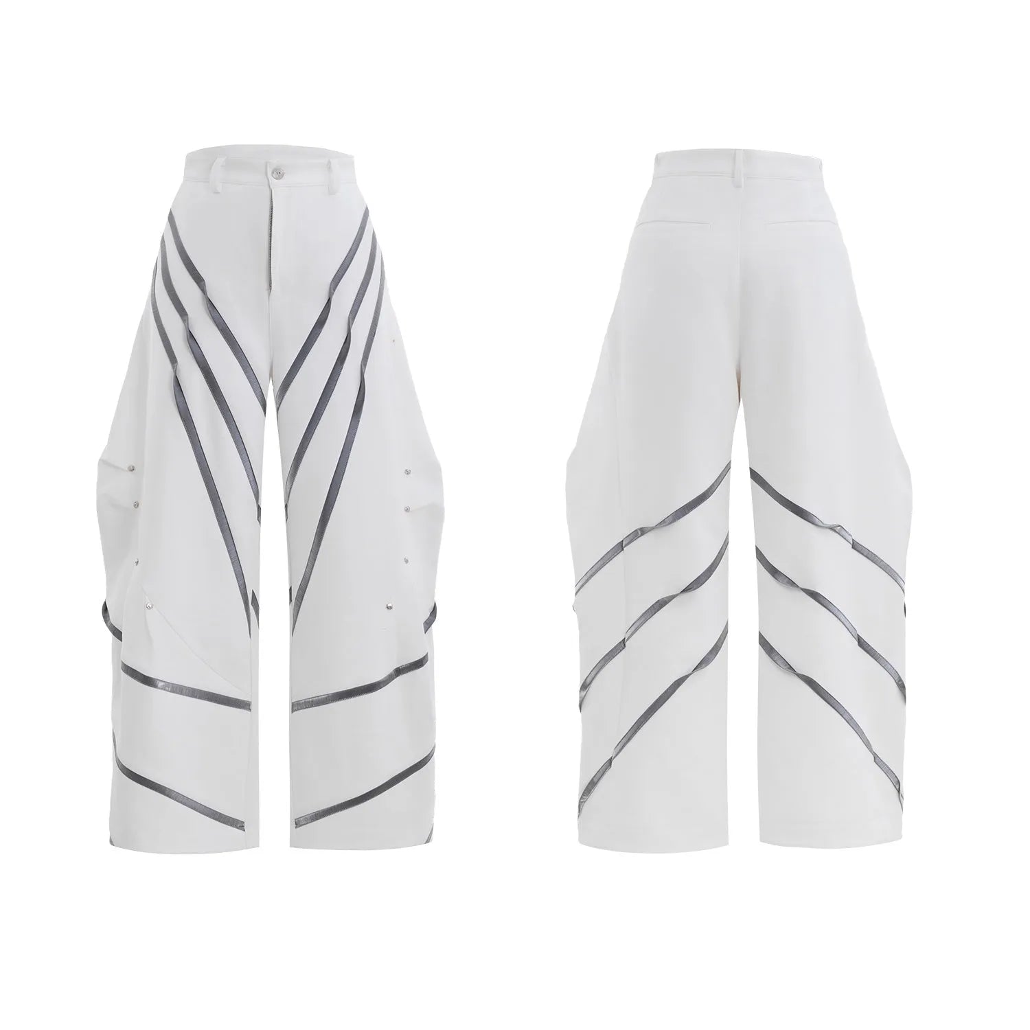 Men's black and white deconstructed trousers with metal striped rivets and front pleats.