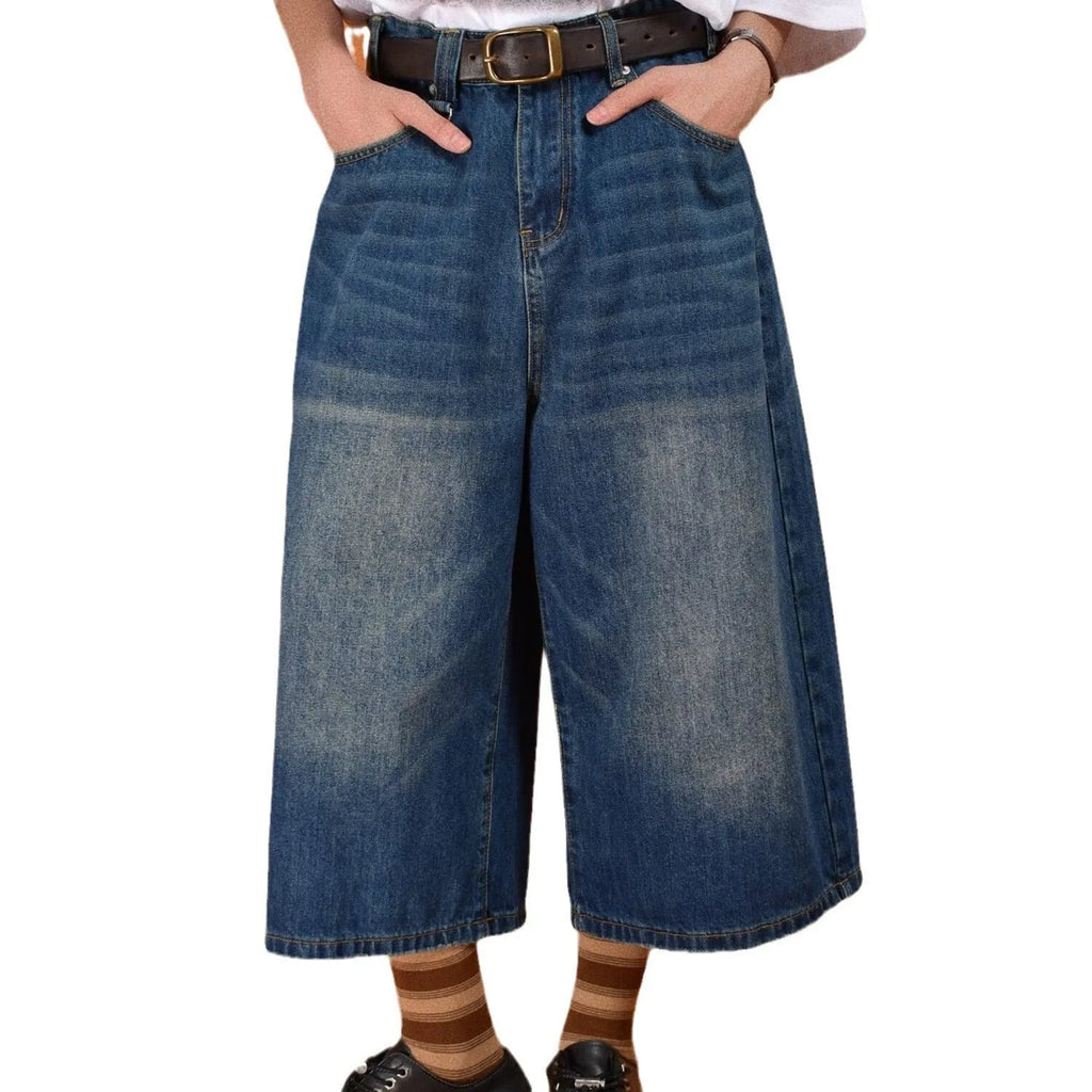 Men's loose straight-leg denim shorts in blue on a plain background