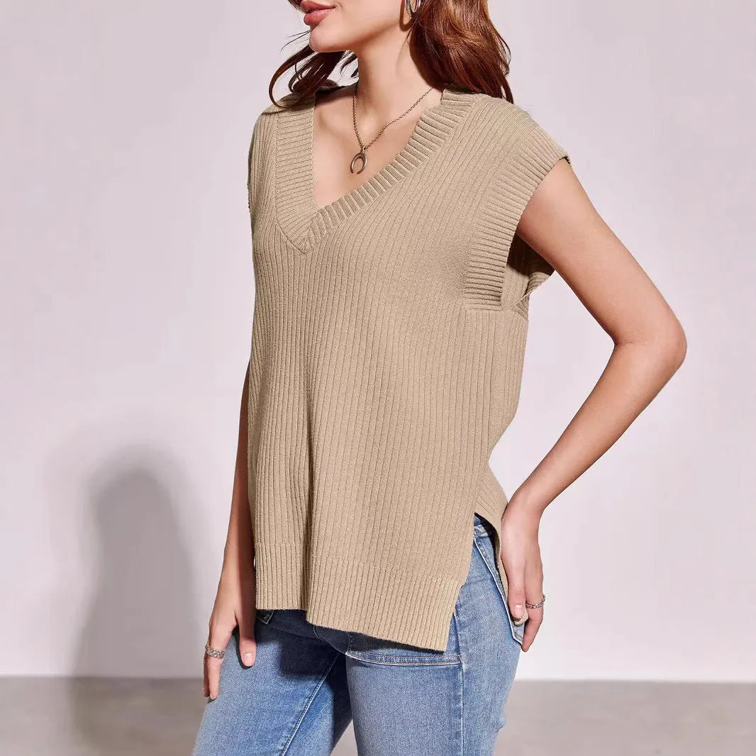 Camel and white loose v-neck sleeveless vest with striped or plaid pattern.