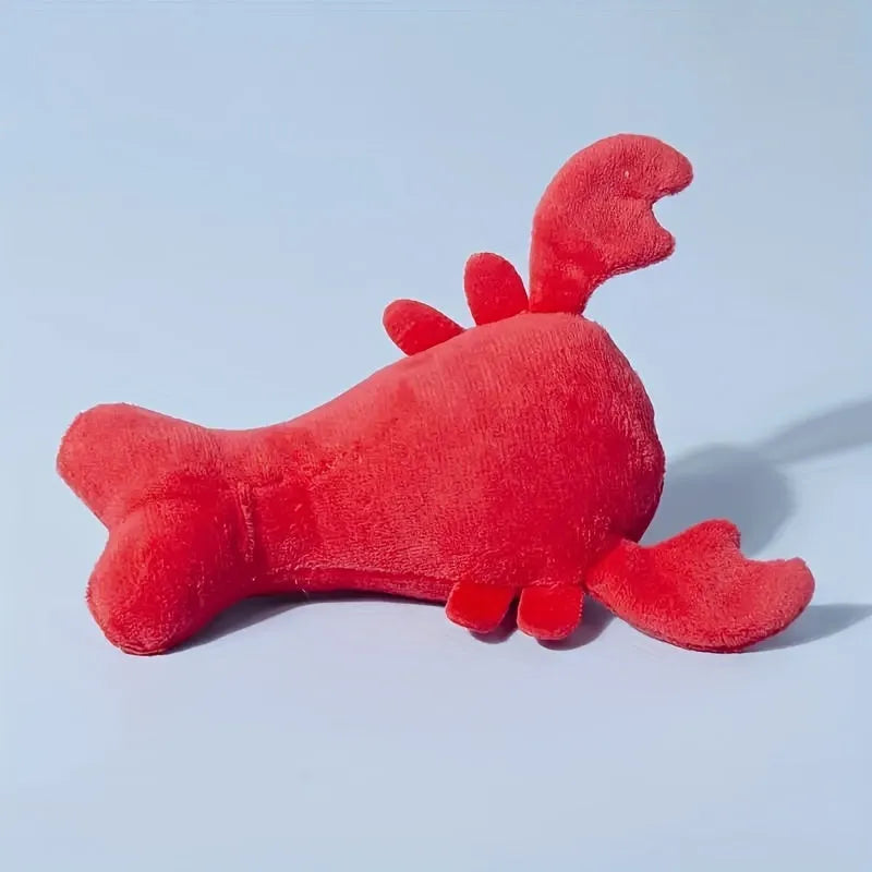 Red lobster-shaped squeaky plush dog toy with bite-resistant construction for small and medium breeds