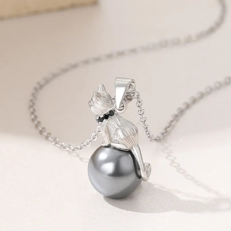 925 sterling silver cat pendant necklace on a chain, elegant style, shown in two colour finishes.
