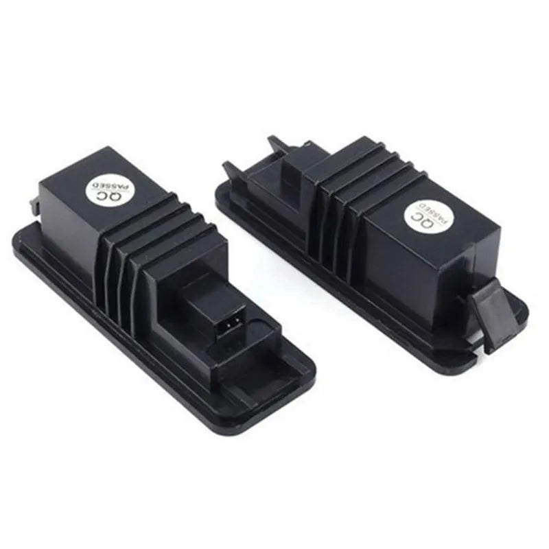 Two Volkswagen LED license plate light units with multiple white SMD LEDs visible.