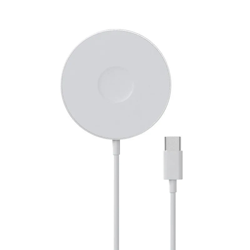 Mini magnetic three-in-one wireless charger in silver with Type-C port on desk next to devices