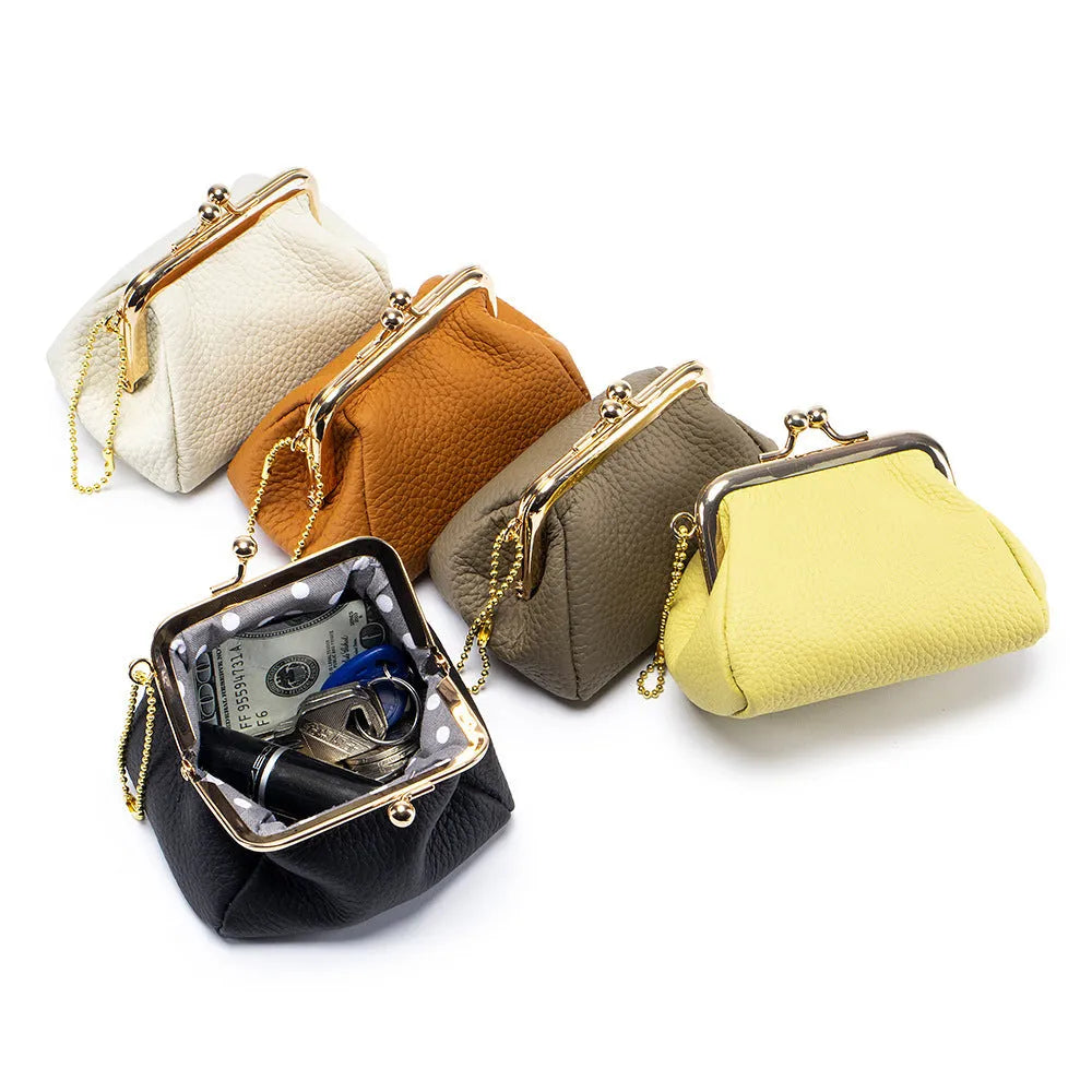 Genuine leather mini coin wallet in solid colour with visible sewing thread detail, first layer cowhide construction