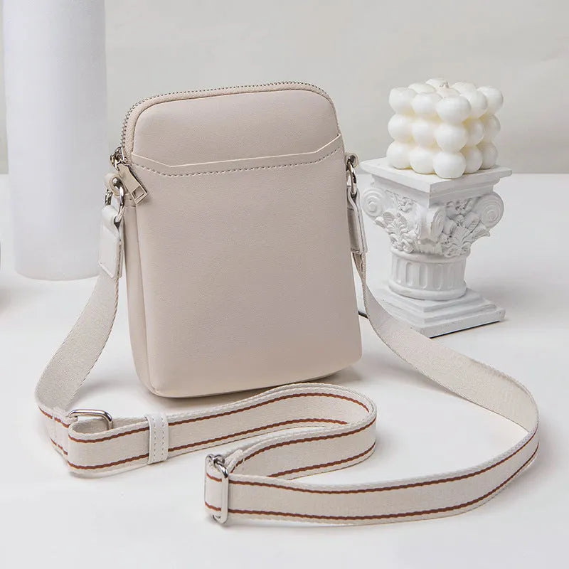 Solid colour PU leather mobile phone crossbody shoulder bag shown in beige.