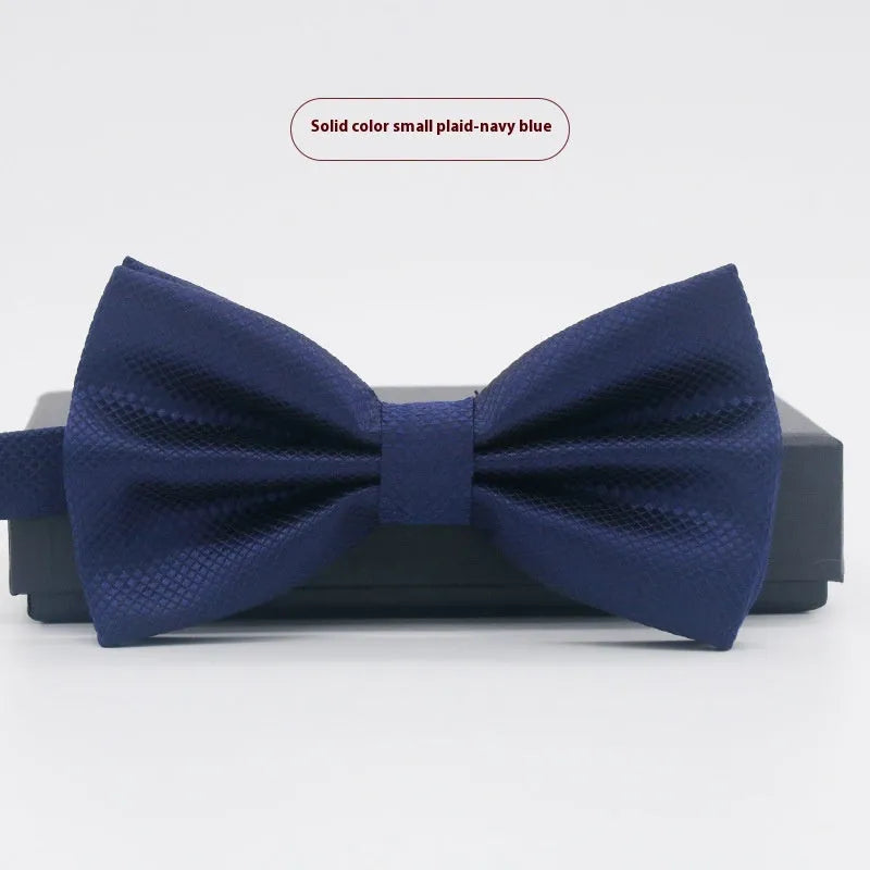 Solid colour flat head bow tie for formal wear in multiple colours including black, red, and blue.