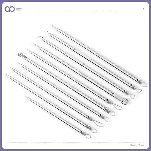 Four silver metal acne needles with ultra-fine pointed tips for skin treatment.