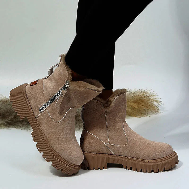 Women's black thick plush high top snow boots with side zipper and round toe on a rubber sole.