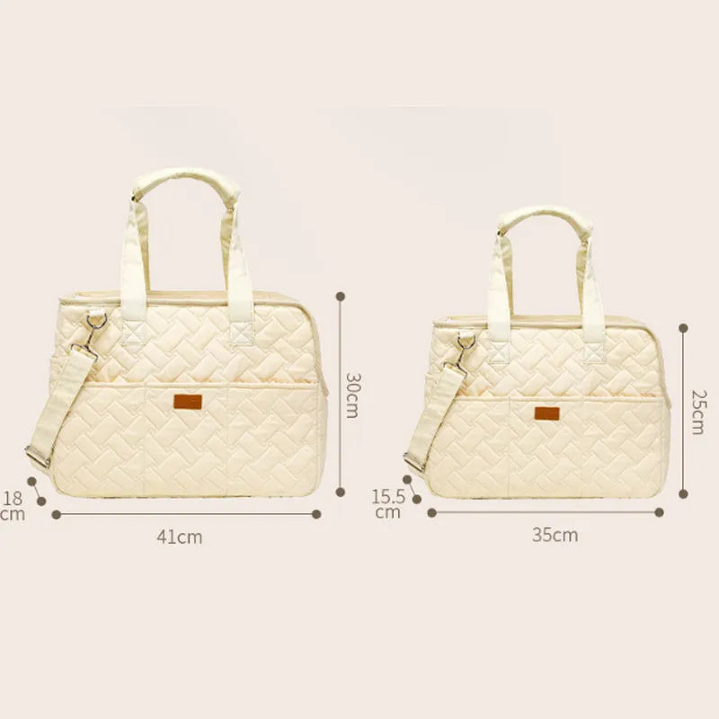 Grey pet carrier handbag with mesh side panels and multiple pockets for a small dog