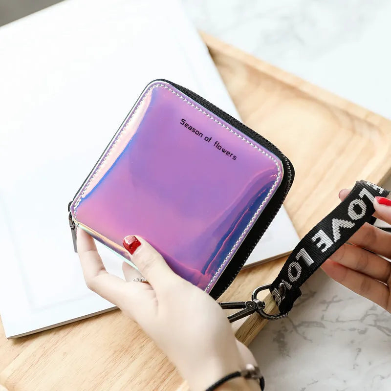 Women's short folding Korean-style wallet in glitter blue or green colours showing 11cm dimensions