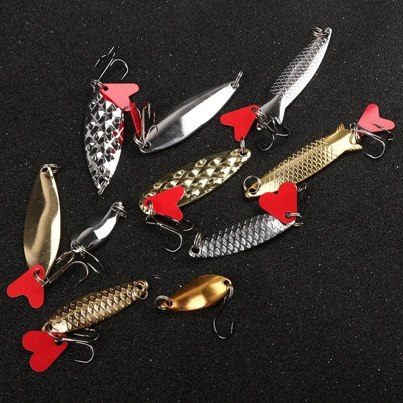 Fishing lure box with pineapple-shaped iron false baits and metal sequins in gold and silver colours