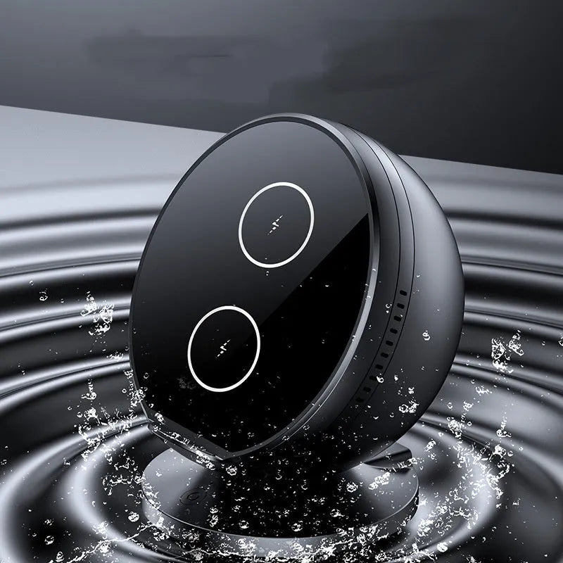 Black multifunctional mobile phone wireless charger holder with Bluetooth speaker, showing phone in cradle.