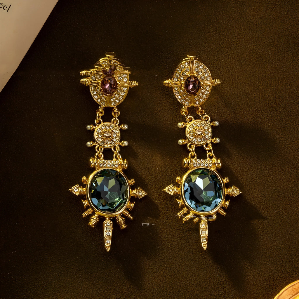 A pair of gold-coloured retro geometric stud earrings with a round shape and diamond-treated alloy surface.