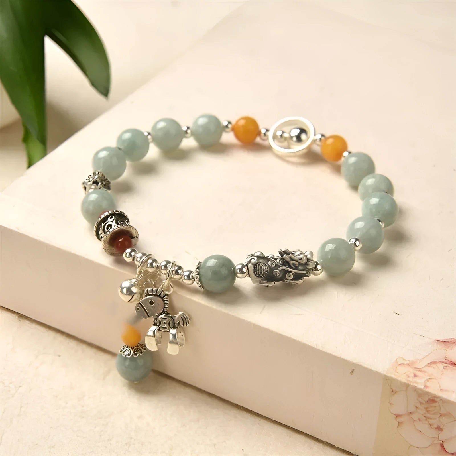 Natural emerald green vintage bracelet with jade stones on an alloy band, showing retro hand-crafted design.