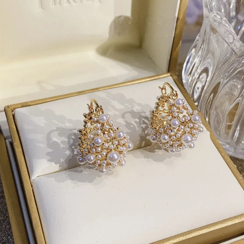 Gold copper flower basket earrings for women with pearl inlay and small bead details