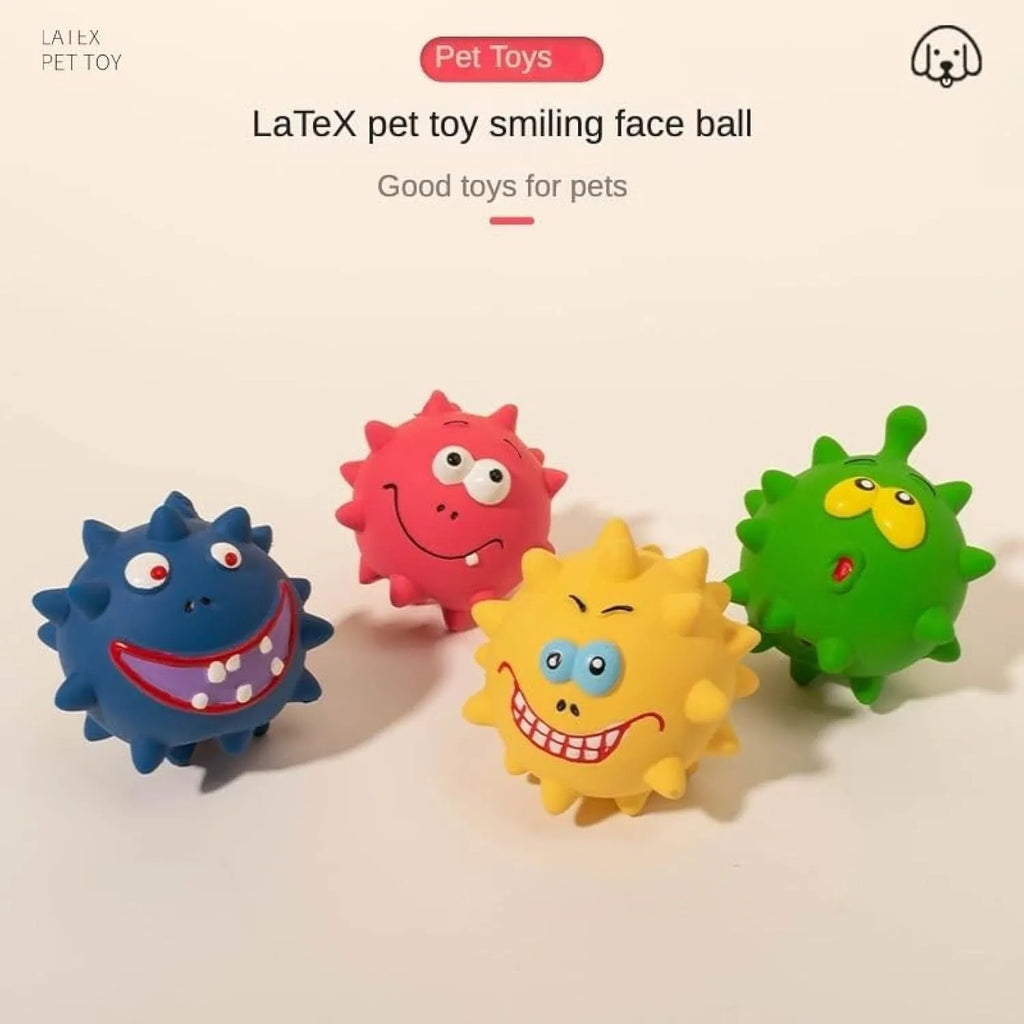 Set of four coloured latex squeaky dog balls with cute faces on a bumpy surface.