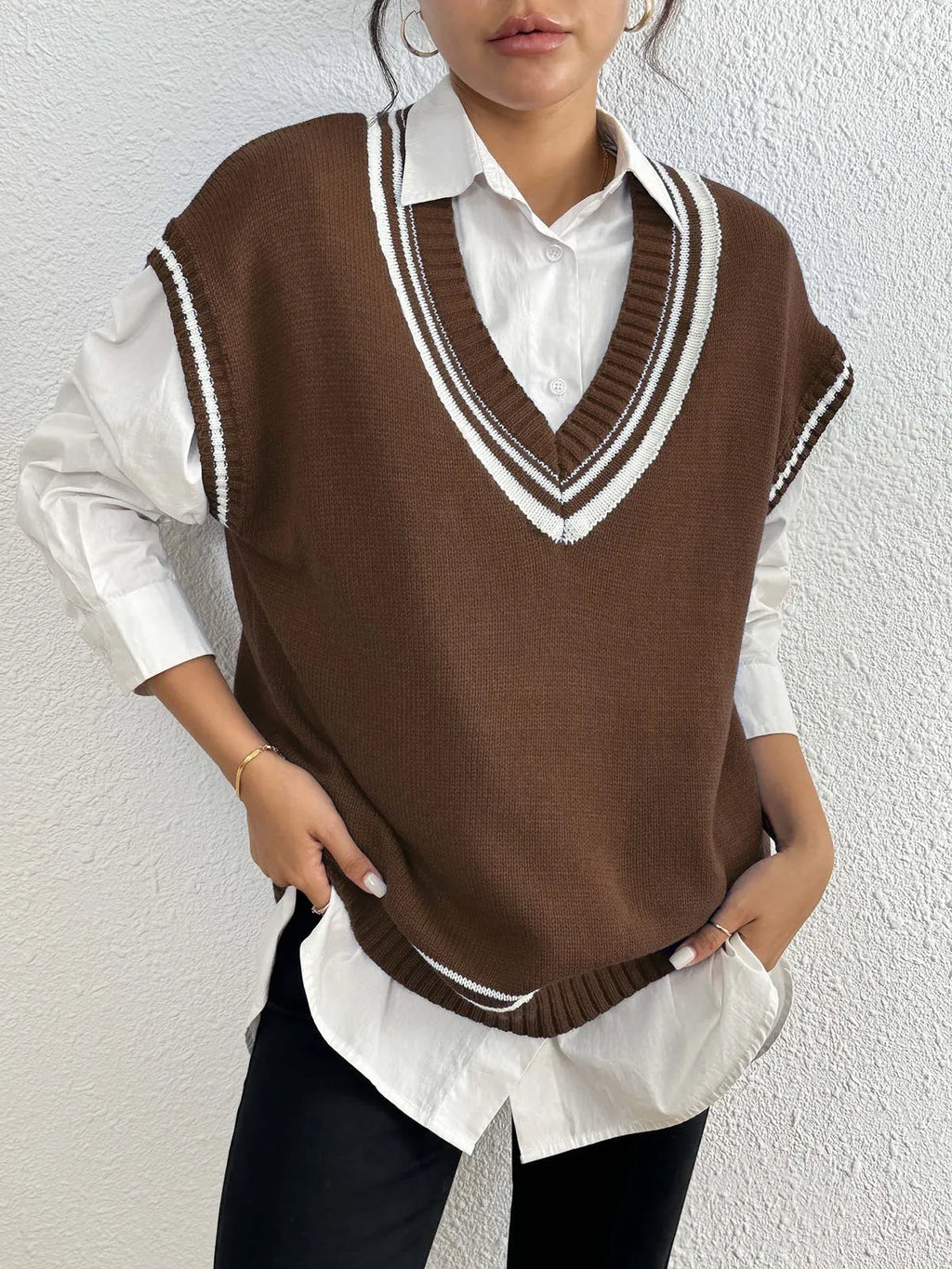 Women's loose-fit college-style pullover vest jumper in black, blue, or coffee colour.