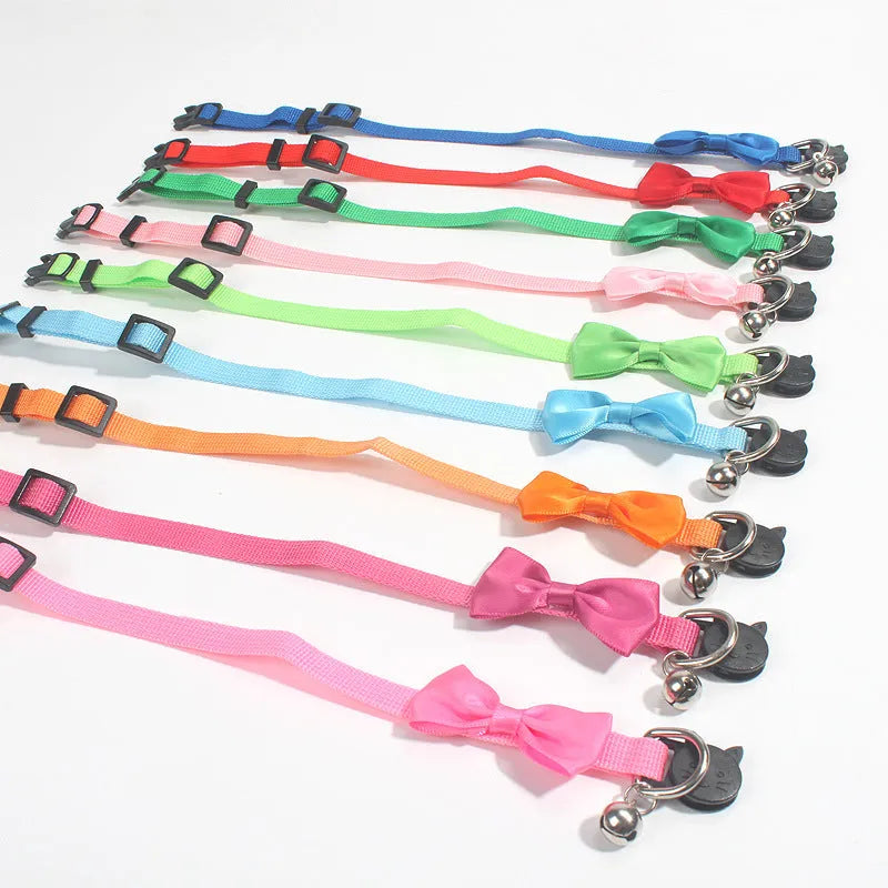 Striped multi-colour adjustable nylon cat collar with a small bell attached.