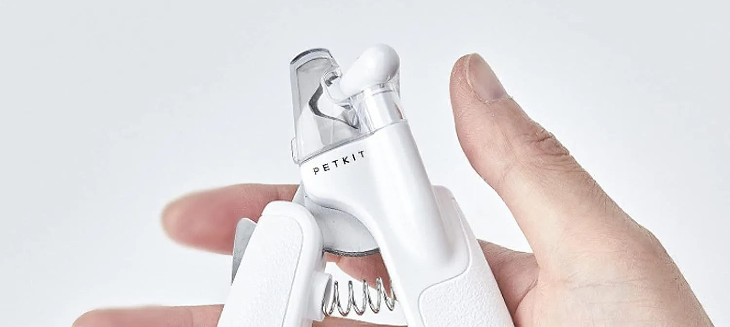 White pet nail clippers with LED light and transparent anti-splash guard for cats and dogs