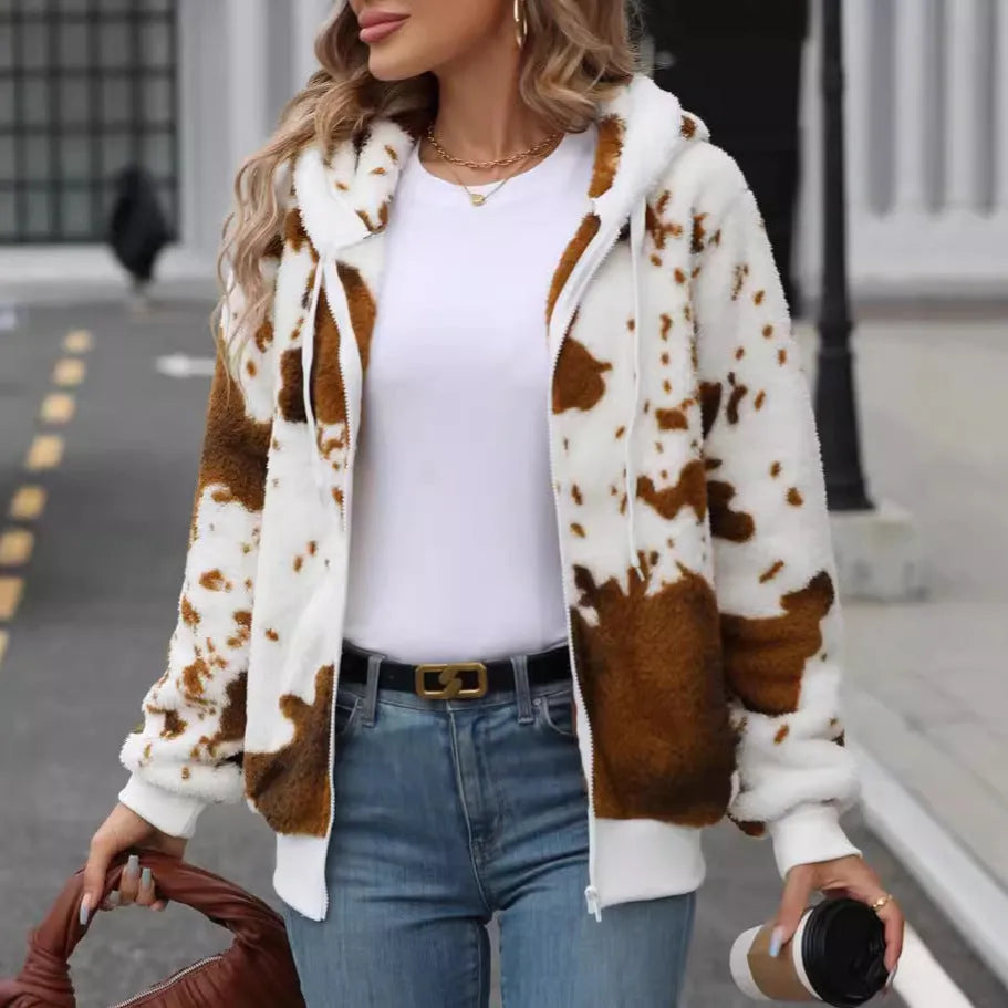 Yellow brown cow print hooded zip cardigan jacket on a hanger