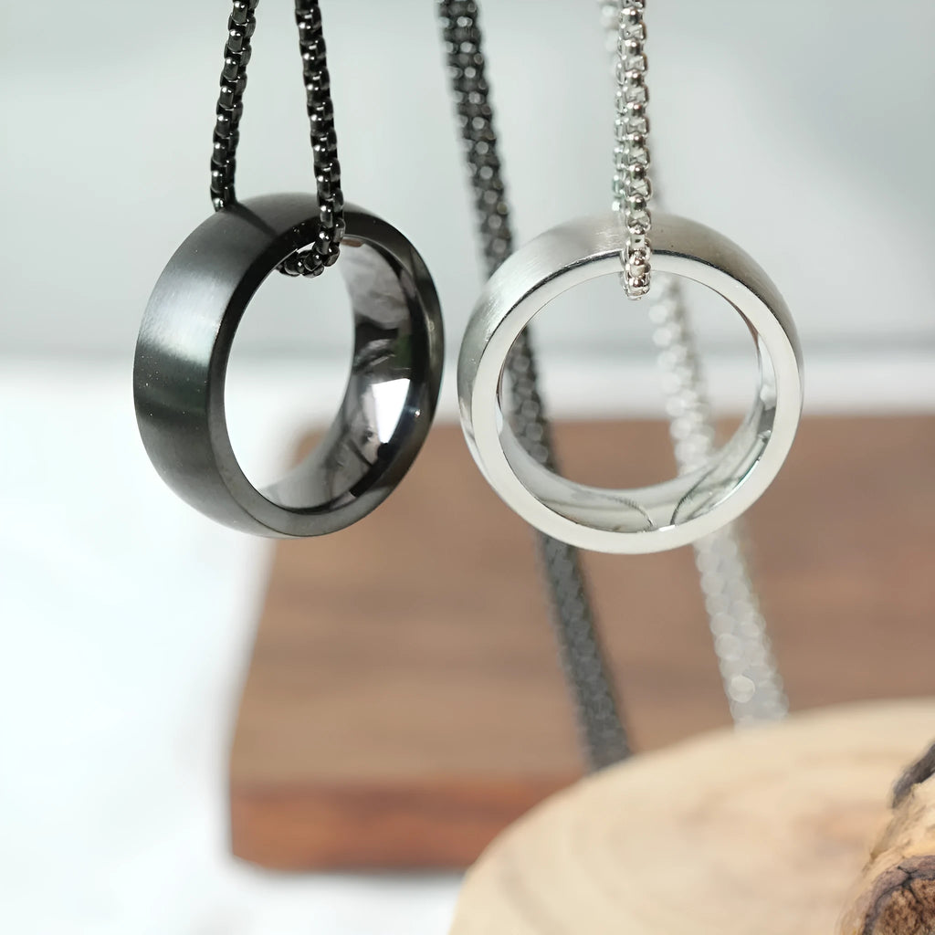 Men's silver pearl chain circle pendant necklace with stainless steel chain and titanium steel pendant on neutral background