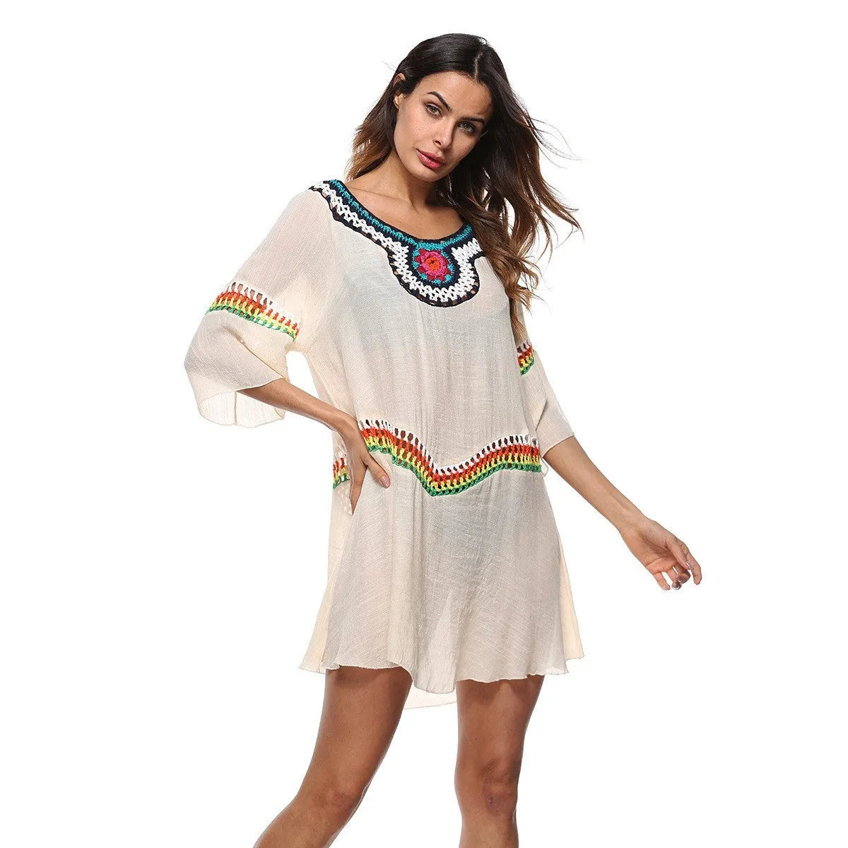 Women's crocheted ethnic style sun protection clothing in apricot colour with beach background