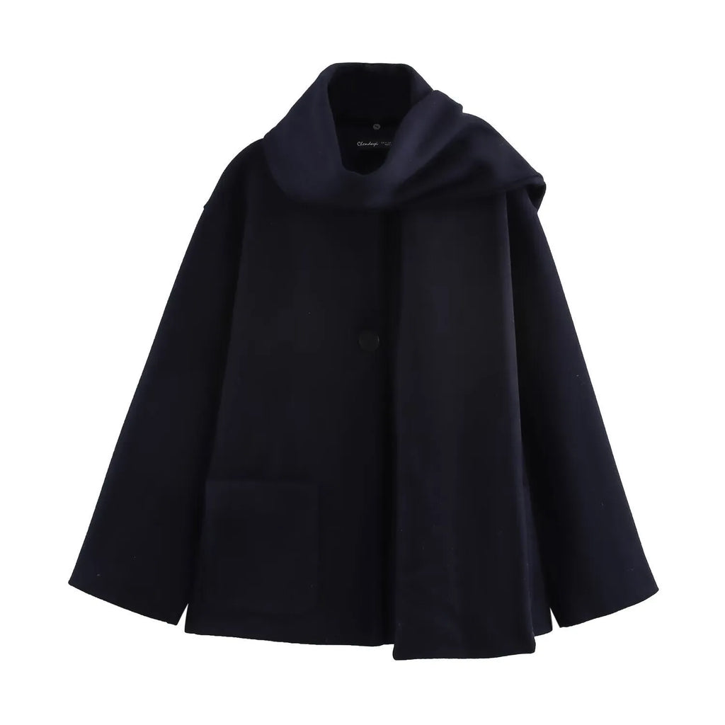 Women's long black polyester winter coat with a fluffy artificial fur collar, shown in a street fashion style.