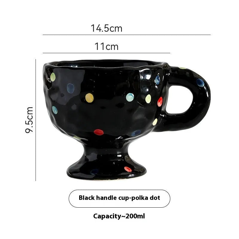 Hand-pinched irregular ceramic mug in solid colour with modern design
