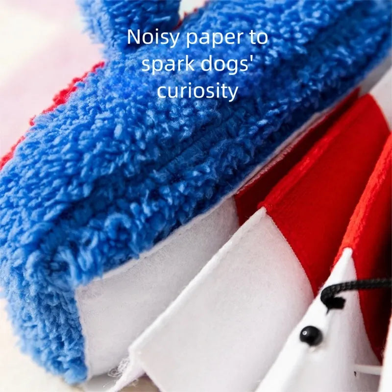 Accordion-shaped dog squeak toy in blue and white for interactive play and stress relief