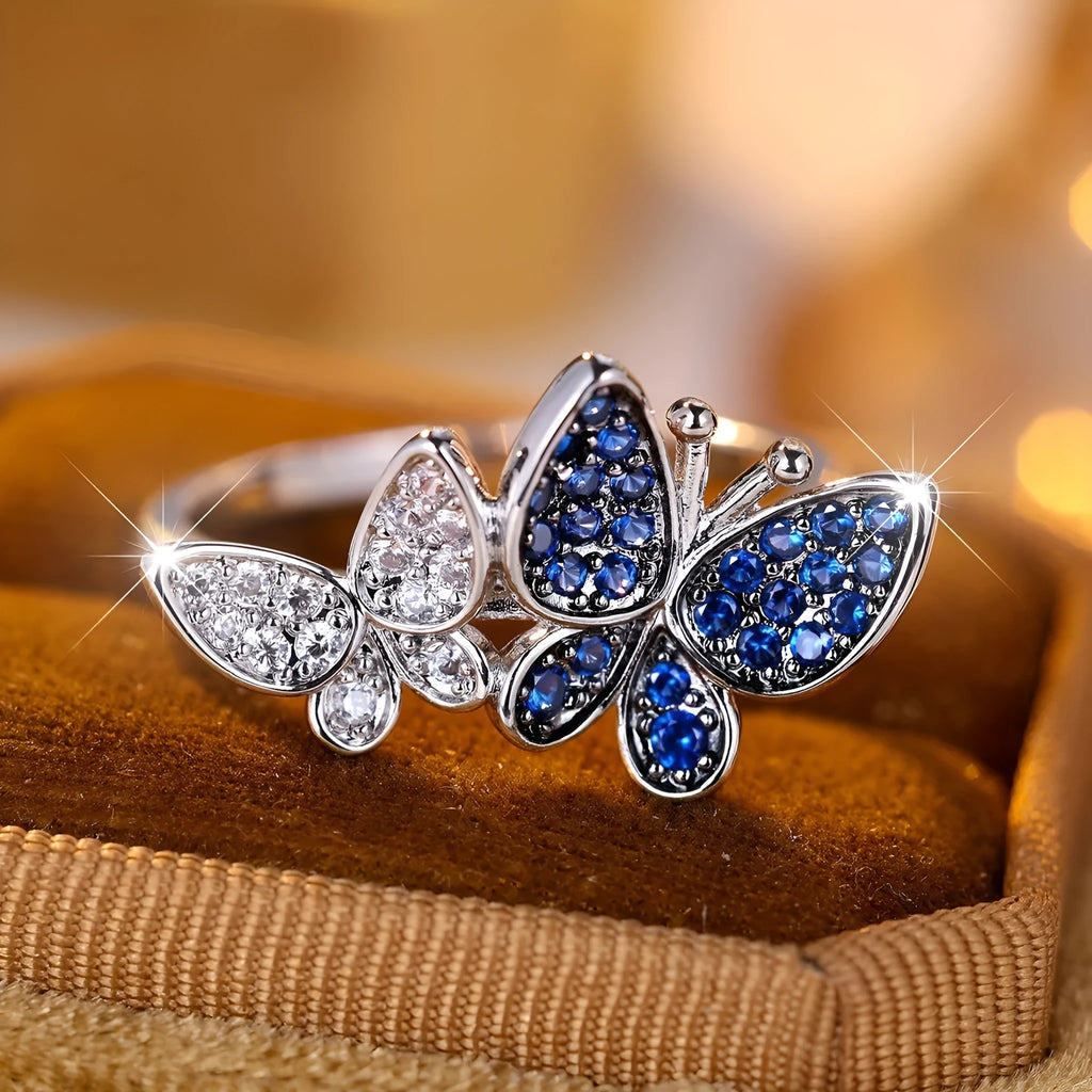 Blue and white copper butterfly ring for women TJZ40135 on plain background