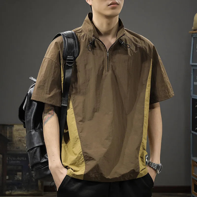Brown men's casual half-zip short-sleeve shirt with a stand collar, showing the fleece-lined interior and loose fit.