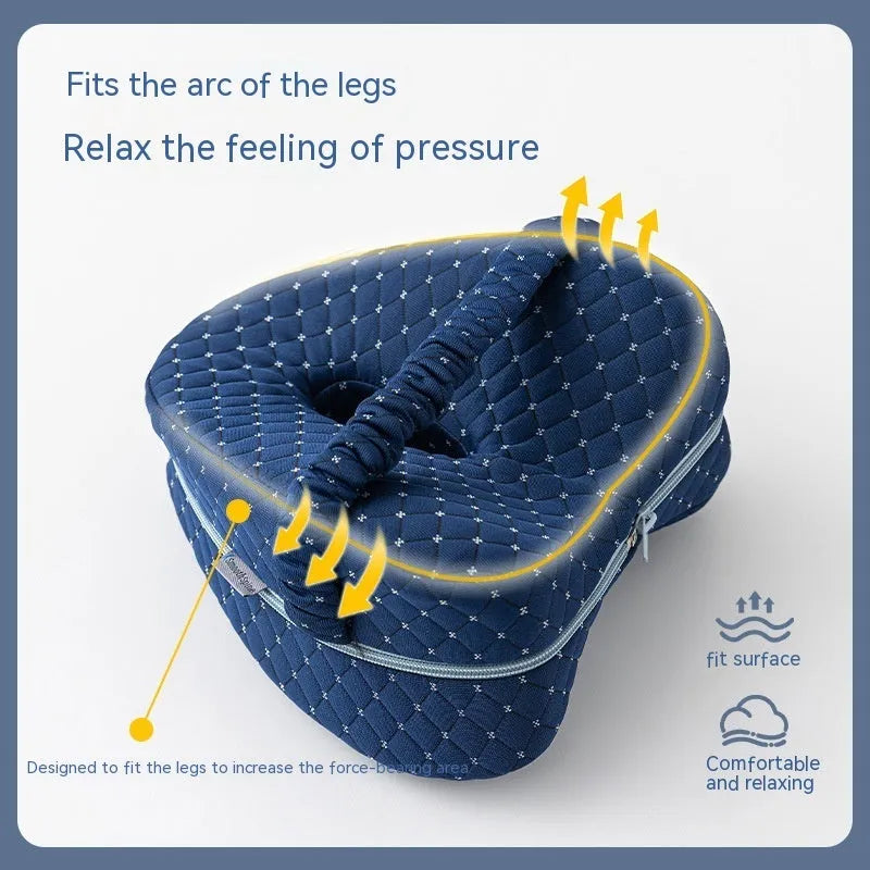 Heart-shaped memory foam leg pillow in blue colour showing dimensions of 25x23x13 cm