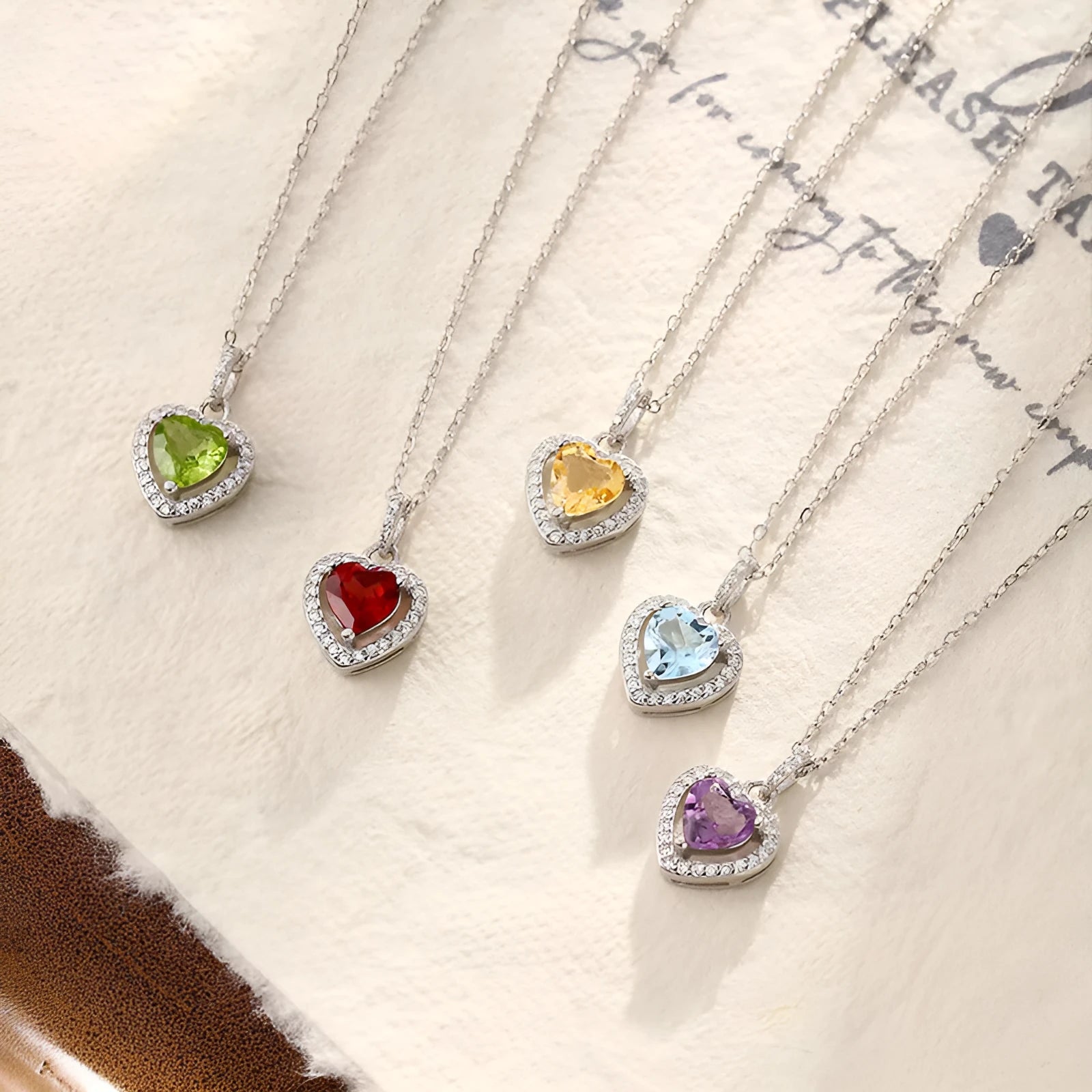 925 silver necklace with heart-shaped pendant containing natural gemstone on cross chain