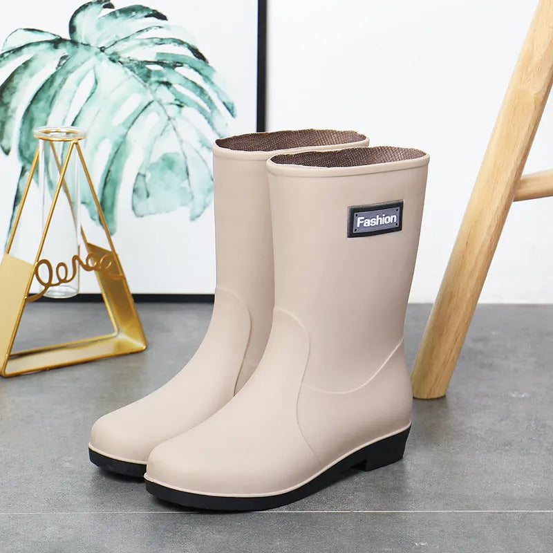 Women's mid-calf PVC rain boots in black with low heel design
