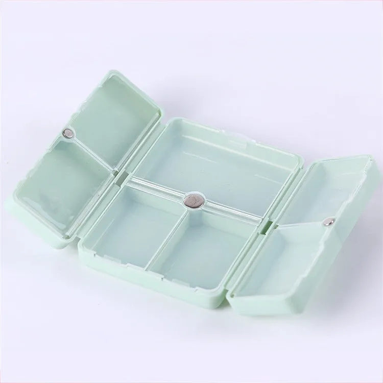 Four-color magnet 7-grid pill box in solid blue colour showing foldable covered design with seven compartments